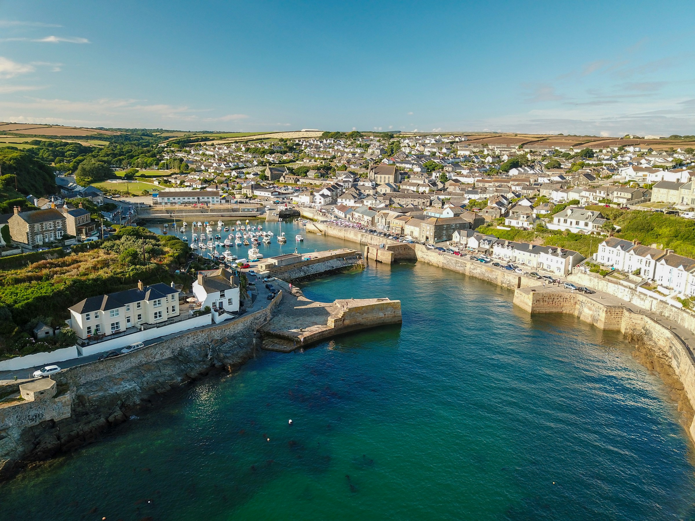 Aerial view of a Cornish harbour town, used by South West CPM to illustrate a commercial property review for landlords in Cornwall.